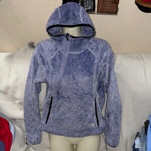 The North Face S/P purple pull over jacket with hood and hidden arm pocket